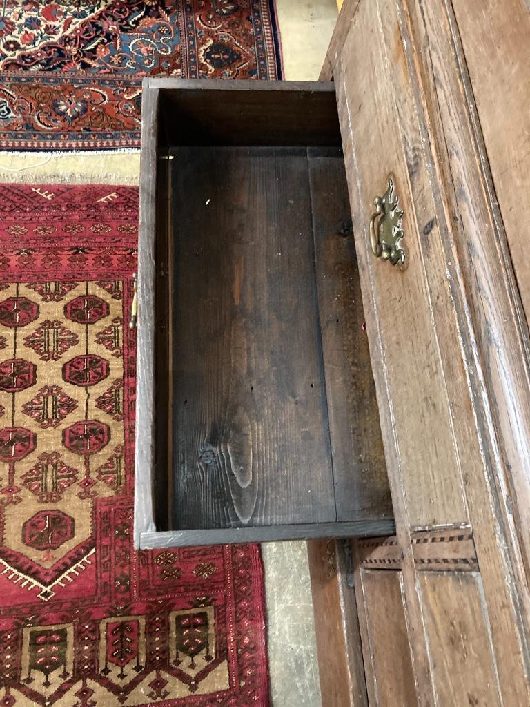 A George III inlaid oak press cupboard, width 140cm, depth 60cm, height 184cm